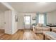 Inviting living room with wood floors, soothing colors, and an open layout to welcome guests at 419 S Oak St, Fortville, IN 46040