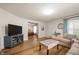 Relaxing living room offering seamless flow to the dining area and abundant natural light at 419 S Oak St, Fortville, IN 46040