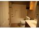Bright bathroom featuring a shower-tub combo, tiled floors and white vanity at 45 Golden Tree Ln, Indianapolis, IN 46227