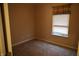Well-lit bedroom featuring neutral walls, carpet, and a window with blinds and a brown curtain at 45 Golden Tree Ln, Indianapolis, IN 46227