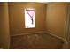 Bright bedroom featuring neutral walls, carpet, and a window with blinds and a purple curtain at 45 Golden Tree Ln, Indianapolis, IN 46227