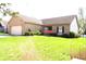 Attractive single-story brick home with a well-kept lawn, attached two-car garage, and inviting landscaping at 45 Golden Tree Ln, Indianapolis, IN 46227