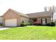 Inviting single-story brick home with attached garage and manicured front yard at 45 Golden Tree Ln, Indianapolis, IN 46227