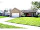 Charming single-story brick home with an attached two-car garage and a well-manicured front lawn at 45 Golden Tree Ln, Indianapolis, IN 46227