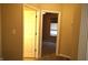 Hallway view showing doorways leading to rooms with neutral walls and carpeted floors at 45 Golden Tree Ln, Indianapolis, IN 46227