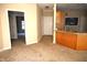 Open-concept kitchen with an island, view to carpeted living room, and modern lighting at 45 Golden Tree Ln, Indianapolis, IN 46227