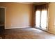 Bright and open living room with neutral carpet, a walk-out patio, and a fresh coat of paint at 45 Golden Tree Ln, Indianapolis, IN 46227