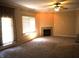 Inviting living room featuring a fireplace, carpeted floor, and a patio door for natural light at 45 Golden Tree Ln, Indianapolis, IN 46227