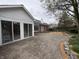 Backyard features a brick patio and mature landscaping at 4586 Aldersgate Dr, Carmel, IN 46033
