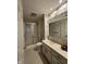 Bathroom features floral wallpaper, shower and tub combination, and vanity sink at 4586 Aldersgate Dr, Carmel, IN 46033