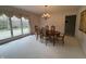 Formal dining room with chandelier lighting and views of the backyard at 4586 Aldersgate Dr, Carmel, IN 46033