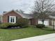 Charming single Gathering home featuring a brick exterior and manicured front yard at 4586 Aldersgate Dr, Carmel, IN 46033