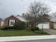 Charming home with brick exterior and landscaped front yard at 4586 Aldersgate Dr, Carmel, IN 46033