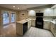 Functional kitchen featuring appliances, ample counter space, and access to the patio at 4586 Aldersgate Dr, Carmel, IN 46033