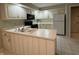 Well-lit kitchen offering ample counter space, cabinetry, and appliances at 4586 Aldersgate Dr, Carmel, IN 46033