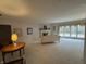 Spacious living room featuring large windows, a fireplace, and neutral decor at 4586 Aldersgate Dr, Carmel, IN 46033