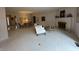 Bright living room with neutral carpet, fireplace, and ample natural light at 4586 Aldersgate Dr, Carmel, IN 46033