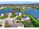 An aerial view of a charming lakeside community with well-manicured lawns at 4827 Spring Flower Ct, Indianapolis, IN 46237