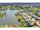 Beautiful aerial view of lakeside homes with a serene lake and lush greenery at 4827 Spring Flower Ct, Indianapolis, IN 46237