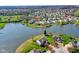 Beautiful aerial view of a lakeside home in a serene suburban neighborhood, featuring lush greenery and water views at 4827 Spring Flower Ct, Indianapolis, IN 46237
