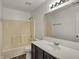 Bathroom with tub and shower combo, vanity, and ample lighting at 4827 Spring Flower Ct, Indianapolis, IN 46237