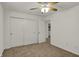 Bedroom with closet, ceiling fan and open doorway at 4827 Spring Flower Ct, Indianapolis, IN 46237