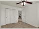 Bedroom boasts ceiling fan, closet, and an open doorway at 4827 Spring Flower Ct, Indianapolis, IN 46237