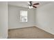 Bedroom with ceiling fan, neutral walls, and a window providing natural light at 4827 Spring Flower Ct, Indianapolis, IN 46237