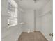 Walk-in closet featuring carpeted floors, shelving and natural light at 4827 Spring Flower Ct, Indianapolis, IN 46237