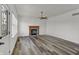 Bright living room featuring modern vinyl floors and cozy fireplace at 4827 Spring Flower Ct, Indianapolis, IN 46237