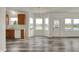 Open-concept living area with a bay window showcasing lake views and modern vinyl plank flooring at 4827 Spring Flower Ct, Indianapolis, IN 46237