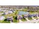 Attractive aerial view of a suburban neighborhood featuring a pond with a fountain at 5083 Castamere Dr, Noblesville, IN 46062