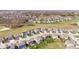 Wonderful aerial view of homes on manicured lawns adjacent to green space, creating a serene atmosphere at 5083 Castamere Dr, Noblesville, IN 46062