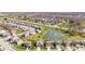 Attractive aerial view of suburban homes and neighborhood pond with fountain at 5083 Castamere Dr, Noblesville, IN 46062