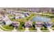 Beautiful aerial view of a suburban neighborhood featuring a pond with fountain at 5083 Castamere Dr, Noblesville, IN 46062