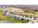 Wonderful aerial view of suburban homes on manicured lawns and adjacent green space at 5083 Castamere Dr, Noblesville, IN 46062