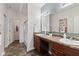 Bathroom featuring double sinks, vinyl floors, and a separate shower at 5083 Castamere Dr, Noblesville, IN 46062