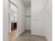 Walk in closet featuring carpeted floors and wire shelving with bathroom entry at 5083 Castamere Dr, Noblesville, IN 46062