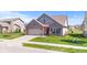 Exterior view of a two-story brick home with well-maintained lawn at 5083 Castamere Dr, Noblesville, IN 46062