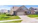 Exterior view of the home with a well-maintained lawn and landscaping at 5083 Castamere Dr, Noblesville, IN 46062