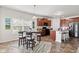 Eat-in kitchen with warm wood cabinets, stainless steel refrigerator, and casual dining area at 5083 Castamere Dr, Noblesville, IN 46062