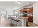 Bright eat-in kitchen offering a modern pendant light above the kitchen island with bar seating at 5083 Castamere Dr, Noblesville, IN 46062