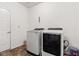 Laundry room featuring modern washer and dryer, and convenient access to the outdoors at 5083 Castamere Dr, Noblesville, IN 46062