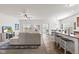 Open-concept living area featuring a large sectional, adjacent kitchen, and an inviting atmosphere at 5083 Castamere Dr, Noblesville, IN 46062