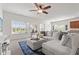 Spacious living room boasts natural light, comfortable sectional and inviting decor at 5083 Castamere Dr, Noblesville, IN 46062