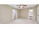 A bright bedroom offering large windows and neutral walls, carpeted throughout at 509 Nelson Dr, Brownsburg, IN 46112