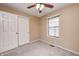 Bedroom offers ample closet space, neutral carpeting and a window for natural light at 509 Nelson Dr, Brownsburg, IN 46112