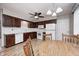 Kitchen features hardwood floors, wooden cabinets, and bright white appliances at 509 Nelson Dr, Brownsburg, IN 46112