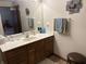 Bathroom features a vanity with drawers, wall art, and plenty of counter space at 5122 Montpelier Ct, Columbus, IN 47203