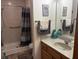 Bathroom with shower, vanity, mirror, and hardware at 5122 Montpelier Ct, Columbus, IN 47203